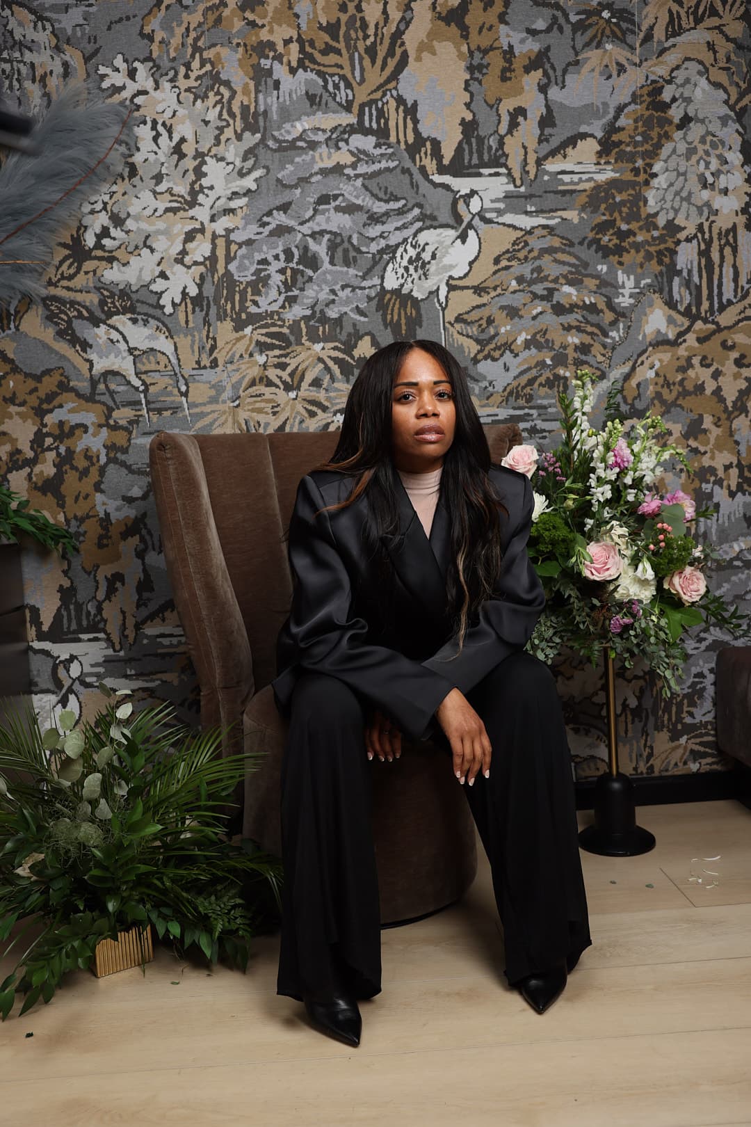 Keena Williams editorial portrait in black suit.